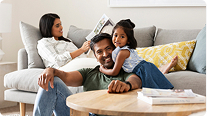 Family relaxing together on living room sofa